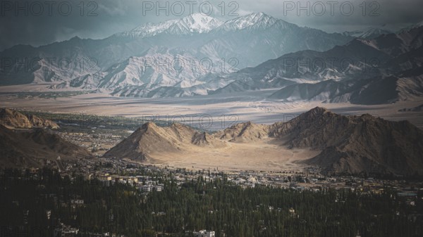 Colorful landscape with mountains and a sun-drenched valley, trekking in Ladakh, Stok la, Himalayas, India