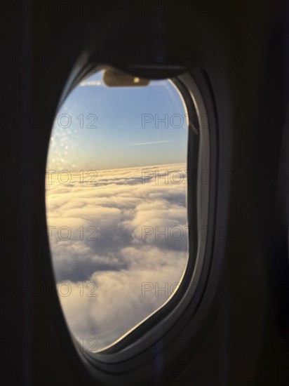 View of a sea of clouds from an airplane window, Finland