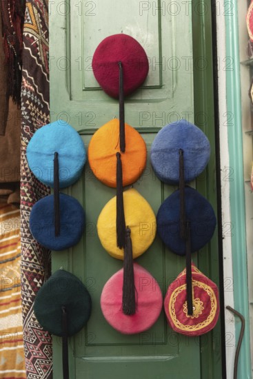 Colourful Tunisian Chechia, traditional soft wool hats popular in the Maghreb region of North Africa for sale in Souk Ech-Chaouachine, the Medina of Tunis, Tunisia