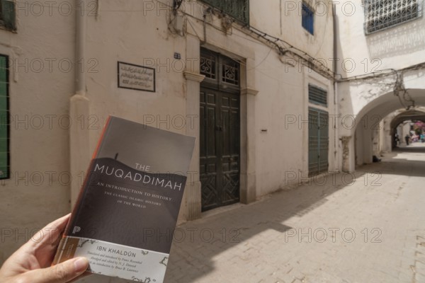 Tunis, Tunisia. May 15th 2024 A copy of The Maqaddimah, classic Islamic history written by Arab philosopher Ibn Khaldun outside of his childhood home in the Medina of Tunis, Tunisia