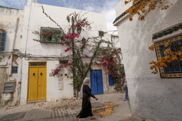 Tunis, Tunisia. 7th May 2024 Traditional blue and yellow doors of typical Tunisian architecture in the colourful alleyways of the Medina in Tunis, capital of Tunisia, North Africa