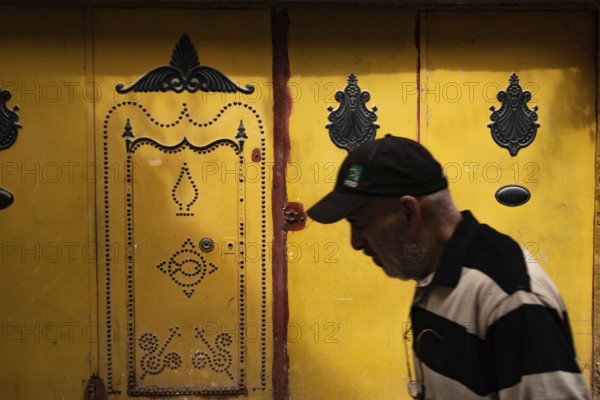 Tunis, Tunisia 7th May, 2024 Beautiful decorated traditional yellow door in the souk of Tunis Medina, a UNESCO world heritage district of Tunis, Capital of Tunisia