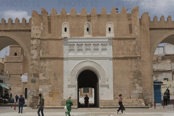 Ancient fortified gate of Sfax Medina, known as Beb Diwan or Bab el Bhar is the etrance to the old city and typical Tunisian souk of Sfax, Tunisia