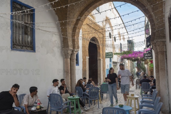 Tunis, Tunisia. 29th May 2024 Young Tunisians and tourists enjoy the café culture in the alleyways of the alleyways of Tunis Medina, the historical quarter of Tunisian capital, Tunisia, North Africa