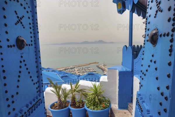 Stunning view of the Gulf of Tunis and the Mediterranean from the beautiful cliff top town of Sidi Bou Said, known for its cobbled streets and blue and white architecture