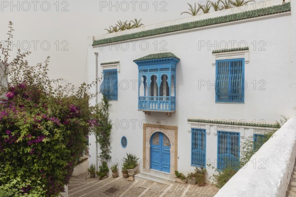 May 17th 2024. Sidi Bou Said, Tunisia. Traditional blue and white architecture of a beautiful villa overlooking the Gulf of Tunis in the village of Sidi Bou Said, Tunisia
