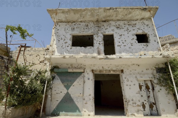 Kafranbel, Idlib, Syria. June 21st 2013 A bullet riddled building in the war torn town of Kafra Nabl in Idlib province of northwest Syria