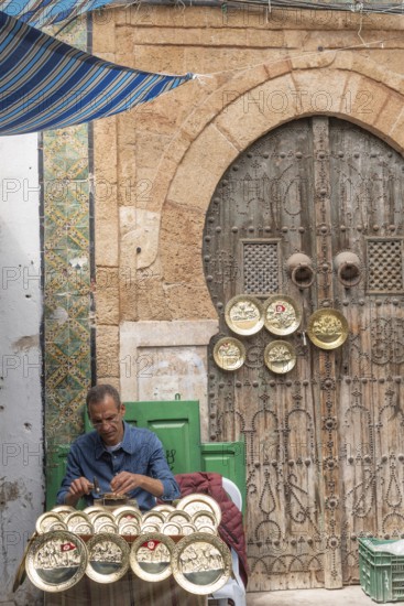 Tunis, Tunisia. 2nd May 2024 A local Tunisian craftsman at work in the Medina, a busy market popular with tourist and locals shopping in Tunis, the capital of Tunisia