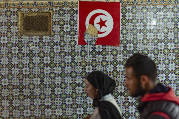 Tunis, Tunisia 2nd May, 2024 Typical Tunisian decorated wall of a restaurant with a Tunisian flag in the World Heritage designated Medina of Tunis, Tunisia, North Africa