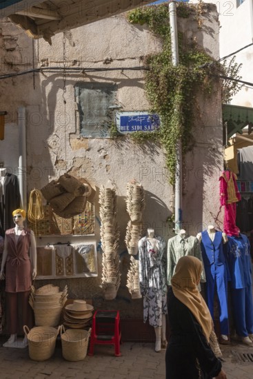 Tunis, Tunisia. 7th May 2024 Goods outside a shop on Rue Sidi Saber, one of the many narrow streets that make up the Medina or Kasbah of Tunis, a busy market popular with tourists and locals shopping, Tunisia