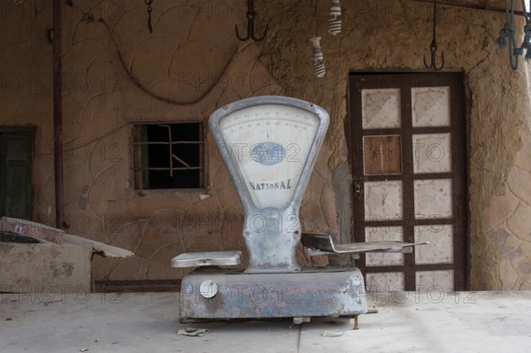 Siwa, Egypt, April 15th 2018 A dusty set of scales outside a closed shop in the Egyptian Oasis town of Siwa, Egypt
