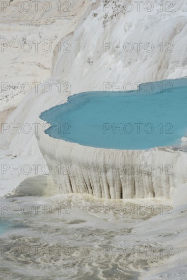 Stunning aqua blue pools of natural mineral rich spring water with many healing properties in beautiful Pamakkule, the cotton castle of western Turkey, a major Turkish tourist destination