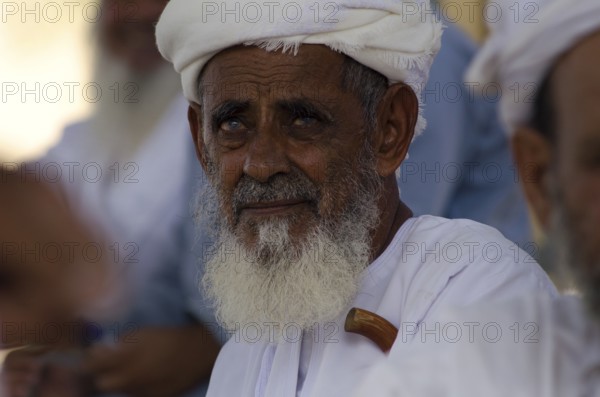 Nizwa, Oman. May 30th 2014 Portrait of an old Omani farmer at the Friday livestock market, Nizwa, Oman