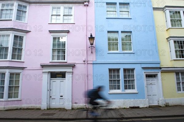 Oxford, England, UK. February 2nd, 2020 An Oxford university student cycles along Hollywell Street, Oxford city center, England, UK