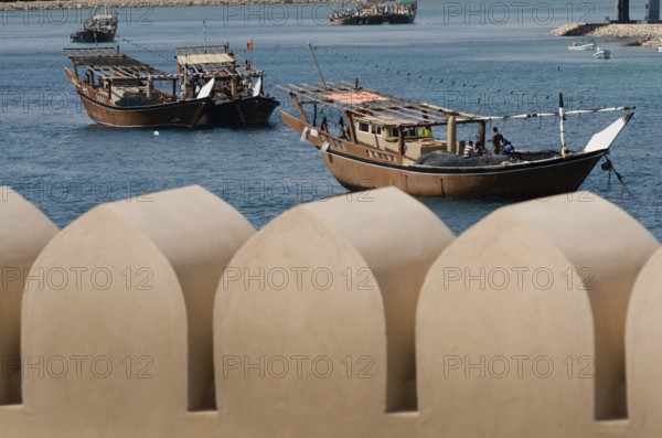 Traditional Omani Dhows anchored in the historic harbor of Sur on the Gulf of Oman