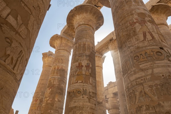 Ancient Egyptian Pharaoh hieroglyphic relief details on columns of the Great Hypostyle Hall of the Temple of Karnak, Luxor, Egypt. Beautiful archaeology of historical city of Thebes