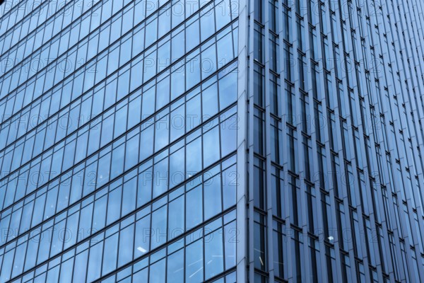 Modern abstract reflections in glass fronted commercial office buildings in the financial district of the British capital London