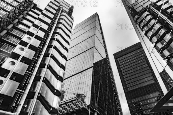 Modern black and white abstract reflections in glass fronted office buildings in the financial district of the British capital London