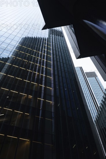 Modern abstract reflections in glass fronted office buildings in the financial district of the British capital London