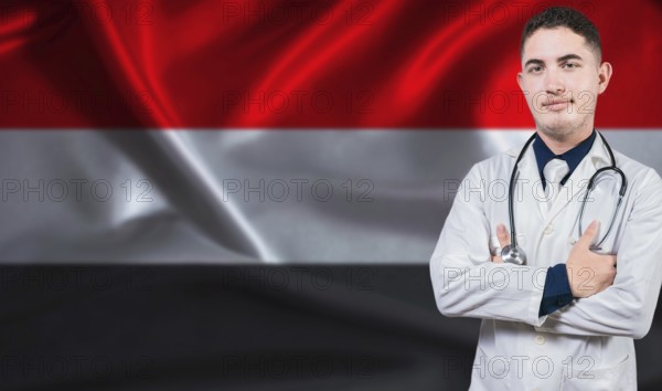 Portrait of medical professional on Yemen flag background. Yemeni national health system