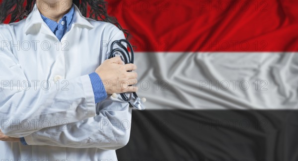 Healthcare professional with Yemen flag background. Professional doctor holding stethoscope on Yemen flag background