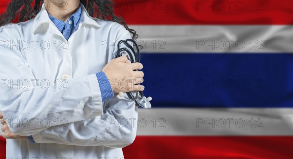 Healthcare professional with Thailand flag background. Professional doctor holding stethoscope on Thailand flag background