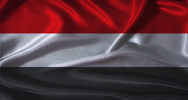 Yemen flag with cloth textured background. National flag of Yemen with realistic texture
