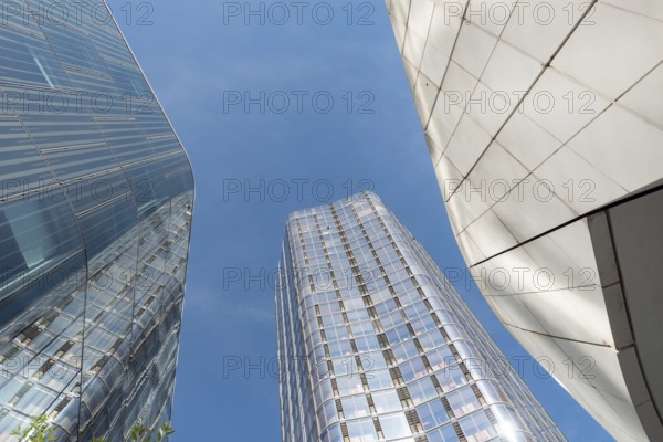 Conceptual futuristic modern glass fronted high rise office buildings in the financial and banking district of London, the British capital, UK