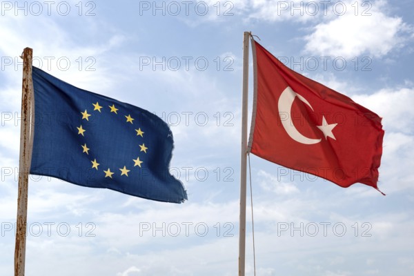 The flag of the European Union flying beside the Turkish flag on a beach in Alanya on the Mediterranean Coast, Turkey