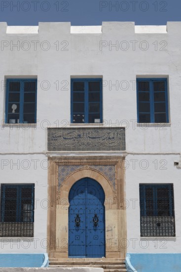 The beautiful blue ornate door and architecture of the Abbasid School inside the Medina of Sfax, Tunisia, North Africa
