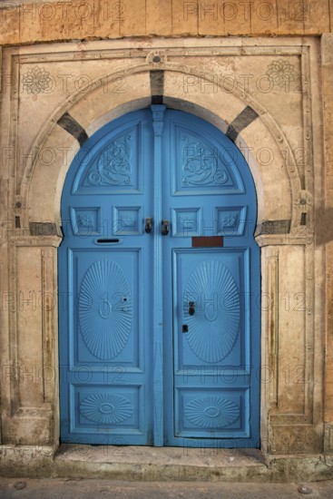 Detailed blue ornate design of a typical door in the Medina of Tunis, a UNESCO designated quarter of the Tunisian capital, Tunisia
