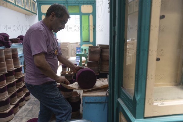 Tunis, Tunisia 22nd May, 2024 A Tunisian artisan uses an iron in the making of the traditional Chechia, a type of woollen hat popular in North Africa, Chaouachis, or Chechia makers once numbered in the thousands but now only a handful practice the craft. Tunis, Tunisia