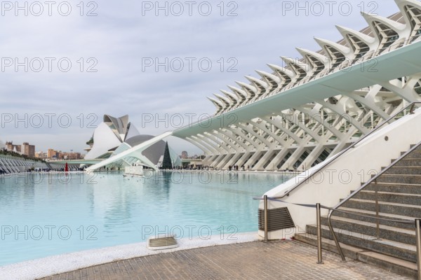 Contemporary architecture of the city of arts and sciences in valencia, spain, reflecting in the large reflecting pool, creating a futuristic and cultural landmark attracting visitors