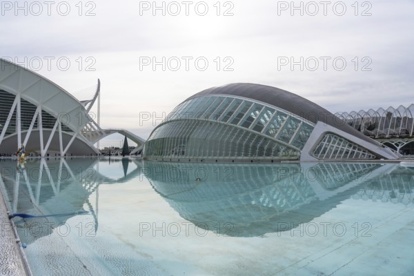 Valencia's city of arts and sciences complex features contemporary architecture reflecting in the vast turquoise pools, symbolizing innovation, futuristic design, and cultural tourism in spain