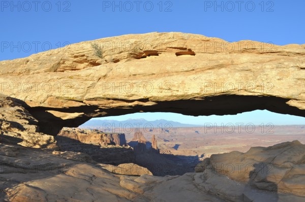 Impressive Mesa Arch rock arch over the vast desert landscape, Canyonlands National Park, Island in the Sky, Utah, USA
