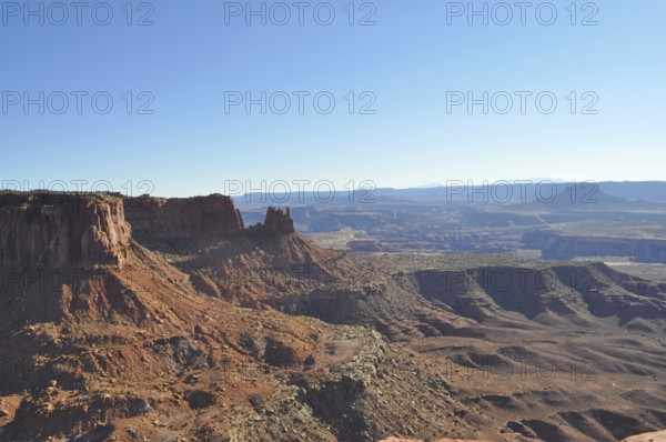 Red rocky canyon under clear blue sky with sweeping views, Canyonlands National Park, Island in the Sky, Utah, USA