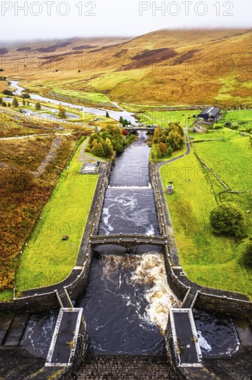 Autumn colors over Claerwen Dam, Claerwen Valley, Elan Valley Reservoir, Rhayader, Powys, Wales, UK