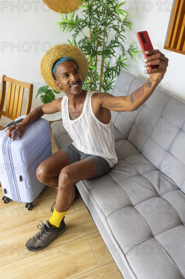 A stylish LGBTQIA+ man prepares for vacation, taking a selfie while holding luggage. The scene captures the excitement and vibrant spirit of travel