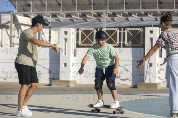 Down syndrome teenager skateboarding with encouragement and support from family members Empowering scene highlighting inclusion, bonding, and active lifestyle
