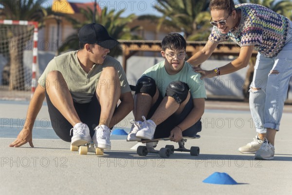 A teenager with Down syndrome enjoys sports with his family, promoting inclusion and joy They participate with an outdoor skateboard, highlighting support and unity