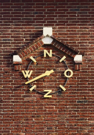 Wind clock on brick wall, Roermond, Limburg Province, Netherlands
