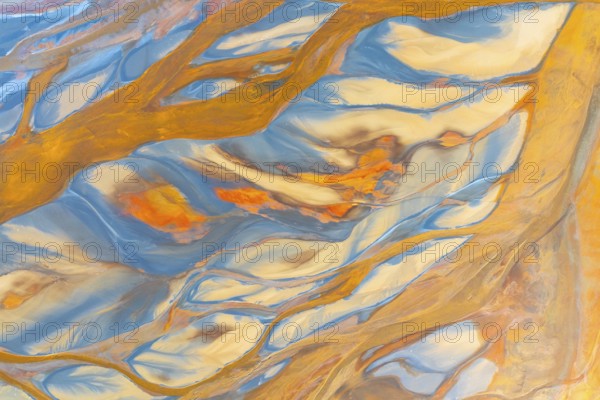 This image showcases a vibrant abstract design with swirling multicolor patterns, resembling fluid art The dynamic blend of colors creates a visually stimulating texture