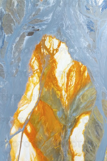 Vibrant multicolor abstract texture featuring dynamic orange and blue hues The flowing patterns create a sense of movement and energy, perfect for creative design