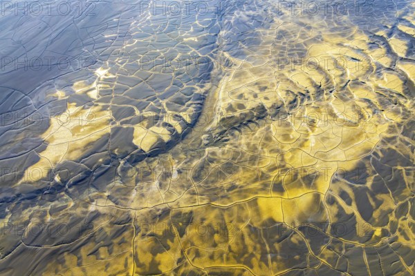Aerial view of multicolor mud patterns, showcasing intricate textures and natural beauty The interplay of colors creates an abstract, mesmerizing landscape, highlighting nature's artistry