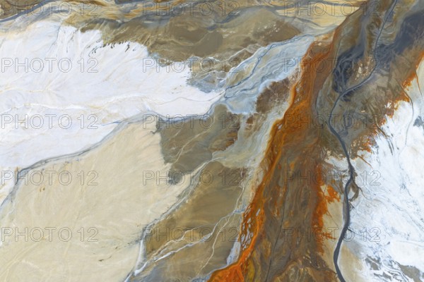 A vibrant abstract composition in earthy tones with flowing patterns, evoking natural landscapes The interplay of colors and textures creates a dynamic visual effect