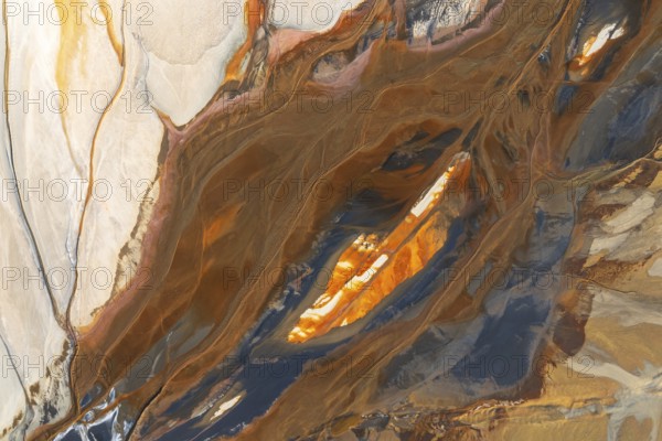 Abstract texture featuring swirling earthy tones intermixed with vibrant orange, cream, and teal accents This composition evokes natural patterns and artistic fluidity