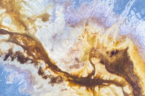 A vibrant abstract texture blending earthy browns and celestial blues, evoking landscapes and ethereal skies Dynamic and fluid, perfect for creative backgrounds