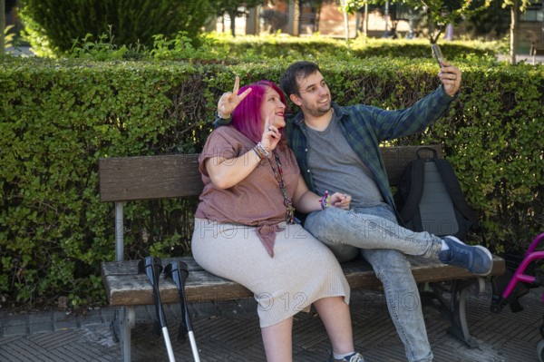 A college couple sitting on a bench, capturing a joyful moment together The woman uses crutches, showcasing their bond and her strength despite a disability from spina bifida