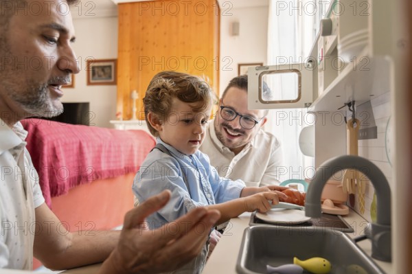 A joyful gay couple shares a bonding moment with their son as they engage in imaginative play at home, creating a warm and supportive family environment