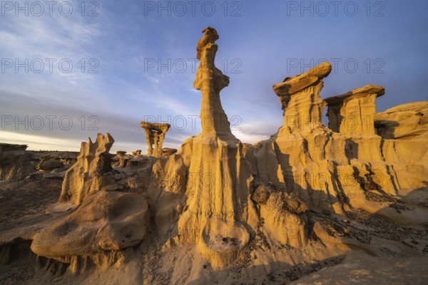 Stunning sandstone formations in Bisti De-Na-Zin Wilderness, New Mexico, captured at sunset These natural sculptures, shaped by wind and water, create a surreal desert landscape